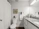 Well-lit bathroom offers granite counters and neutral decor at 506 Dorset Cir, South Daytona, FL 32119