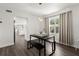 Dining room with modern lighting, black table with benches, and view of the backyard at 506 Dorset Cir, South Daytona, FL 32119