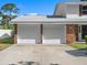 Charming home features a two car garage and lovely curb appeal at 506 Dorset Cir, South Daytona, FL 32119