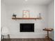 Close up of the brick fireplace with a decorative mantle at 506 Dorset Cir, South Daytona, FL 32119