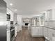 Bright, updated kitchen featuring white cabinets, granite countertops, and stainless steel appliances at 506 Dorset Cir, South Daytona, FL 32119