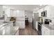Updated kitchen with stainless appliances, granite countertops, and open layout at 506 Dorset Cir, South Daytona, FL 32119