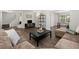 Comfortable living room with stylish decor, featuring hardwood floors and plenty of seating at 506 Dorset Cir, South Daytona, FL 32119