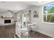 Open living area with brick fireplace and a view of the backyard at 506 Dorset Cir, South Daytona, FL 32119