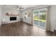 Open living room with fireplace and sliding doors to the backyard at 506 Dorset Cir, South Daytona, FL 32119