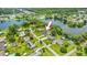 Lakeside home with inground pool nestled amongst large shade trees at 950 Pineapple Rd, South Daytona, FL 32119