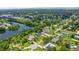 Neighborhood view featuring many homes with large lawns and mature shade trees at 950 Pineapple Rd, South Daytona, FL 32119