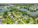 Lakeside homes feature backyard pools and lush, mature landscaping at 950 Pineapple Rd, South Daytona, FL 32119
