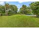 Lush backyard with inviting pool and patio, providing a serene outdoor living space at 950 Pineapple Rd, South Daytona, FL 32119