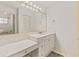 Bright bathroom with an oversized mirror, vanity and make up station, and a sink at 950 Pineapple Rd, South Daytona, FL 32119