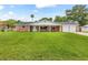Charming brick home with front porch and attached two car garage at 950 Pineapple Rd, South Daytona, FL 32119