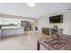 Spacious kitchen with white cabinets, stainless steel appliances, and a view into the living spaces at 950 Pineapple Rd, South Daytona, FL 32119