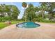 Private pool with surrounding green landscape and ample room for outdoor recreation at 950 Pineapple Rd, South Daytona, FL 32119