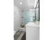 Modern bathroom features a glass shower with marble tile and a vanity with white countertop at 105 Bonita Pl, Ormond Beach, FL 32174