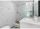 Bathroom features a large walk-in shower with marble-style tile and sleek fixtures at 105 Bonita Pl, Ormond Beach, FL 32174
