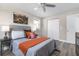 Well-lit bedroom showcases a gray headboard, neutral walls, gray flooring, and a desert scene painting at 105 Bonita Pl, Ormond Beach, FL 32174