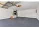 Spacious two-car garage with ample room for parking and storage with freshly painted walls and epoxy floor at 105 Bonita Pl, Ormond Beach, FL 32174
