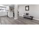 Open hallway with gray floors connecting living spaces to the kitchen at 105 Bonita Pl, Ormond Beach, FL 32174