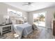 Well-lit primary bedroom with a plush rug, slider to patio, and neutral color palette at 105 Bonita Pl, Ormond Beach, FL 32174