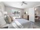 Comfortable primary bedroom featuring a ceiling fan, sliding glass doors to the pool and backyard at 105 Bonita Pl, Ormond Beach, FL 32174