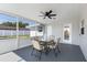 Covered patio offers outdoor dining and relaxation with views of the backyard and pool at 105 Bonita Pl, Ormond Beach, FL 32174