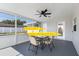 Covered patio offers outdoor dining and relaxation with views of the backyard and pool at 105 Bonita Pl, Ormond Beach, FL 32174