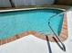 Enjoy relaxing by this refreshing pool with brick trim, concrete patio, and a convenient grab rail at 105 Bonita Pl, Ormond Beach, FL 32174