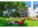 Spacious backyard featuring a fire pit and multiple seating arrangements at 1221 Gamble Pl, Daytona Beach, FL 32118