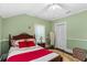 Charming bedroom with vintage furniture, hardwood floors, and ample natural light at 1221 Gamble Pl, Daytona Beach, FL 32118
