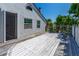 This deck features a painted surface with a decorative railing and view of the backyard at 1221 Gamble Pl, Daytona Beach, FL 32118