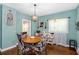 Charming dining room with hardwood floors, decorative light fixture, and stylish furnishings at 1221 Gamble Pl, Daytona Beach, FL 32118