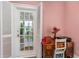 Entrance showing french doors, wood floors, and a glimpse of outdoor greenery at 1221 Gamble Pl, Daytona Beach, FL 32118