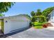 Spacious detached garage with ample parking and well-maintained landscaping at 1221 Gamble Pl, Daytona Beach, FL 32118