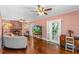 Inviting living room features a fireplace, ceiling fans, french doors, and hardwood floors at 1221 Gamble Pl, Daytona Beach, FL 32118
