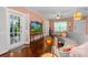 Living room featuring hardwood floors, french doors, and a stylish grey sofa at 1221 Gamble Pl, Daytona Beach, FL 32118