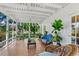 Spacious screened-in porch with tiled flooring and views of the garden at 1221 Gamble Pl, Daytona Beach, FL 32118