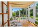 Bright sunroom with floor-to-ceiling windows and stylish seating, perfect for relaxation at 1221 Gamble Pl, Daytona Beach, FL 32118