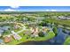 Aerial view of home in lakeside community with lush surroundings at 1904 Rouzbeh Ct, Port Orange, FL 32128