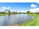 Scenic view of the lake from the lush green lawn at 1904 Rouzbeh Ct, Port Orange, FL 32128