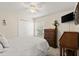 Comfortable bedroom featuring a ceiling fan, closet, window, and carpet flooring at 1904 Rouzbeh Ct, Port Orange, FL 32128