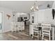 Eat in dining area with breakfast bar, kitchen and dining table with bright modern design at 1904 Rouzbeh Ct, Port Orange, FL 32128