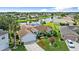 Home featuring manicured lawn, mature landscaping, and an attached two-car garage at 1904 Rouzbeh Ct, Port Orange, FL 32128