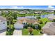 Charming waterfront home with a well-manicured lawn, screened lanai, and mature landscaping at 1904 Rouzbeh Ct, Port Orange, FL 32128