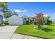 Charming single-story home boasting a well-manicured lawn and attached two-car garage at 1904 Rouzbeh Ct, Port Orange, FL 32128