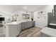 Modern kitchen with white countertops, stainless appliances and eat-in breakfast bar at 1904 Rouzbeh Ct, Port Orange, FL 32128