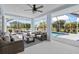 The screened lanai offers ample seating with views of the pool and lush backyard at 1904 Rouzbeh Ct, Port Orange, FL 32128