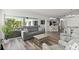 Cozy living room with sliding doors to the lanai, featuring stylish furniture and decor at 1904 Rouzbeh Ct, Port Orange, FL 32128