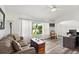 Bright living room with a large window view, decorative accents, and comfortable seating at 1904 Rouzbeh Ct, Port Orange, FL 32128