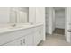 Bright bathroom with double sink vanity, white cabinets, and modern fixtures at 288 Links Terrace Blvd, Daytona Beach, FL 32124