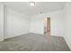 Neutral-toned bedroom showing adjacent bathroom through an open doorway at 288 Links Terrace Blvd, Daytona Beach, FL 32124
